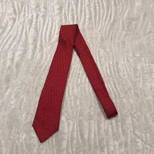 Envoy tie. Red with geometric designs.